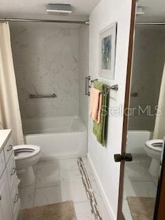 133 Palm View Ct Unit 3513/4, Haines City, FL 33844 - bathroom featuring toilet, shower / bathtub combination with curtain, vanity, and marble look tiles
