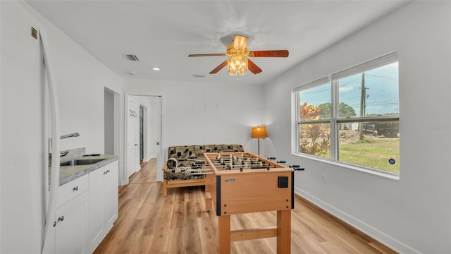 900 Lake Jessie Dr, Winter Haven, FL 33881 - playroom with ceiling fan, light wood-style flooring, baseboards, recessed lighting, and a sink