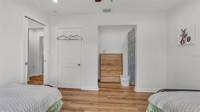 900 Lake Jessie Dr, Winter Haven, FL 33881 - bedroom with light wood finished floors, baseboards, and recessed lighting