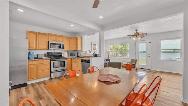 900 Lake Jessie Dr, Winter Haven, FL 33881 - kitchen with appliances with stainless steel finishes, ceiling fan, light brown cabinetry, light wood-style floors, and recessed lighting