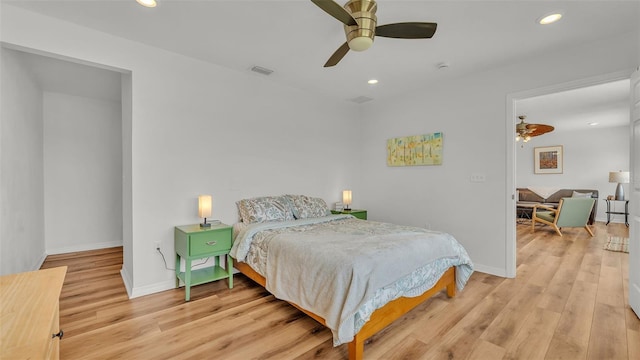900 Lake Jessie Dr, Winter Haven, FL 33881 - bedroom with light wood-type flooring, recessed lighting, baseboards, and a ceiling fan