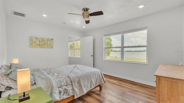 900 Lake Jessie Dr, Winter Haven, FL 33881 - bedroom featuring wood finished floors, baseboards, recessed lighting, and a ceiling fan