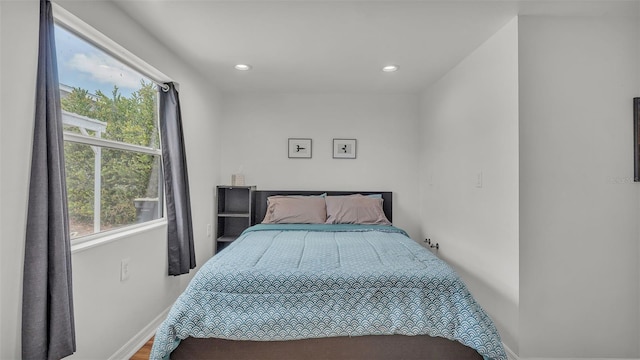 900 Lake Jessie Dr, Winter Haven, FL 33881 - bedroom with recessed lighting, baseboards, and wood finished floors