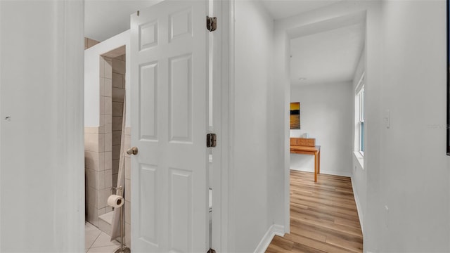 900 Lake Jessie Dr, Winter Haven, FL 33881 - hall featuring light wood-type flooring and baseboards