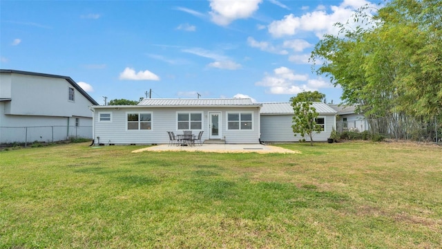 900 Lake Jessie Dr, Winter Haven, FL 33881 - back of house featuring a patio area and metal roof