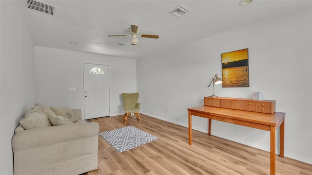 900 Lake Jessie Dr, Winter Haven, FL 33881 - living room with ceiling fan, light wood-style floors, and baseboards
