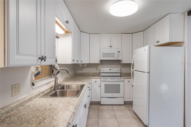 1163 Lake Dr, Lake Wales, FL 33859 - kitchen featuring white appliances, a sink, white cabinetry, and light tile patterned floors