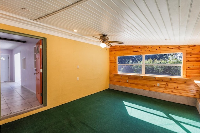 1163 Lake Dr, Lake Wales, FL 33859 - empty room with wooden walls, ceiling fan, carpet floors, and wood ceiling