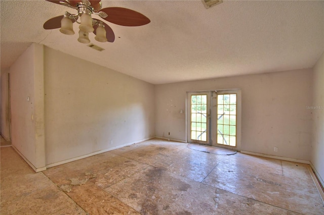 1294 1/2 38th St NW, Winter Haven, FL 33881 - spare room featuring a textured ceiling, a ceiling fan, and baseboards