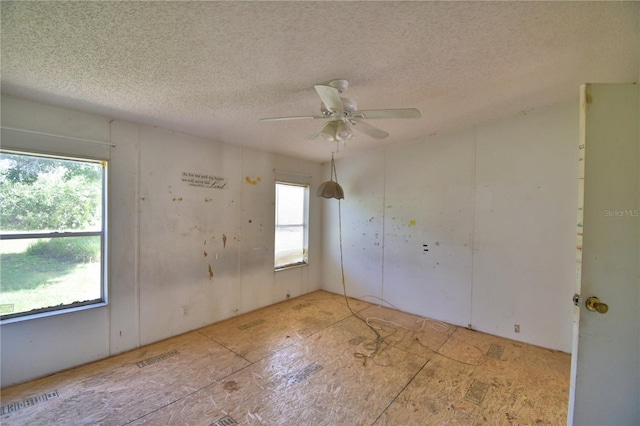 1294 1/2 38th St NW, Winter Haven, FL 33881 - empty room featuring a textured ceiling and ceiling fan