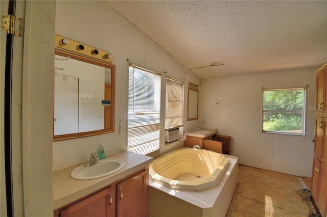 1294 1/2 38th St NW, Winter Haven, FL 33881 - bathroom featuring a textured ceiling, two vanities, and a bath