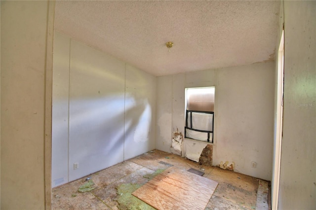 1294 1/2 38th St NW, Winter Haven, FL 33881 - spare room with a textured ceiling