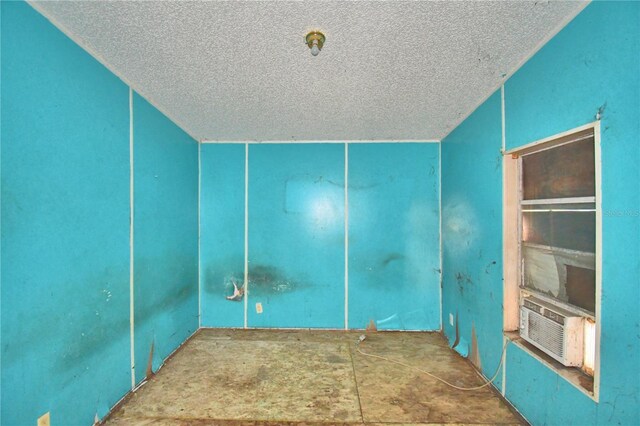 1294 1/2 38th St NW, Winter Haven, FL 33881 - spare room featuring a textured ceiling and cooling unit