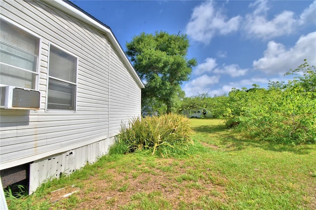 1294 1/2 38th St NW, Winter Haven, FL 33881 - view of side of property with cooling unit and a lawn