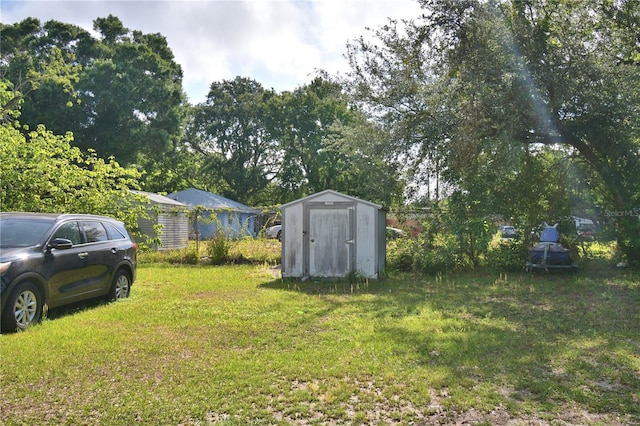 1294 1/2 38th St NW, Winter Haven, FL 33881 - view of grassy yard featuring a shed and an outdoor structure