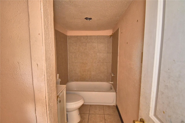 1294 1/2 38th St NW, Winter Haven, FL 33881 - bathroom featuring tile patterned flooring, a textured wall, toilet, a textured ceiling, and washtub / shower combination