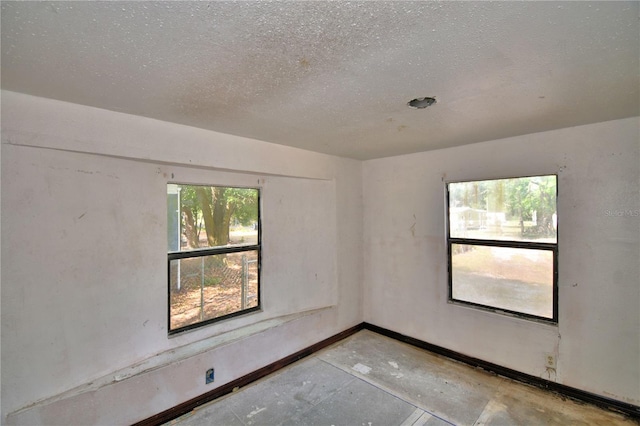 1294 1/2 38th St NW, Winter Haven, FL 33881 - empty room with a textured ceiling