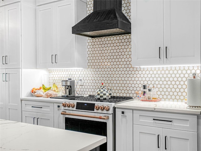 kitchen featuring premium range hood, electric stove, and white cabinets