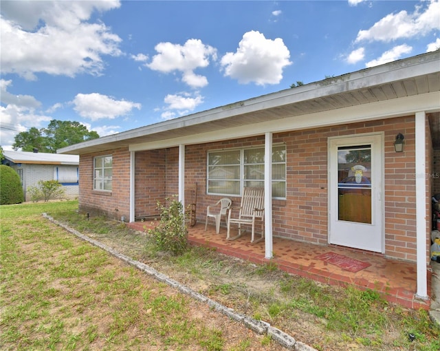 780 Oleander Dr SE, Winter Haven, FL 33880 - property entrance featuring brick siding
