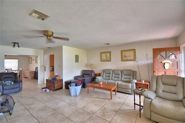 780 Oleander Dr SE, Winter Haven, FL 33880 - living area with light tile patterned flooring and a ceiling fan