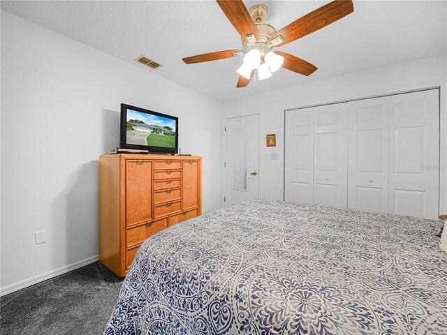 409 N 6th St, Lake Hamilton, FL 33851 - bedroom featuring dark colored carpet, baseboards, a closet, and a ceiling fan