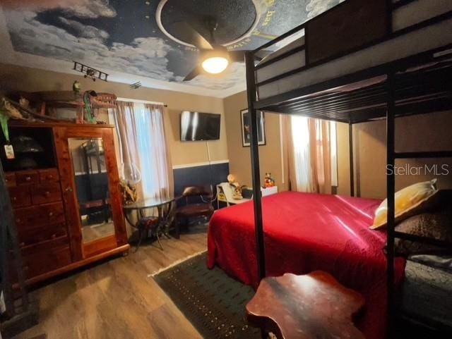 bedroom featuring wood finished floors