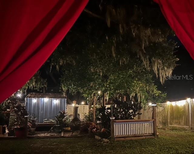 view of yard at night
