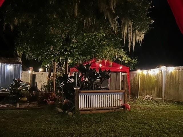 view of yard at night