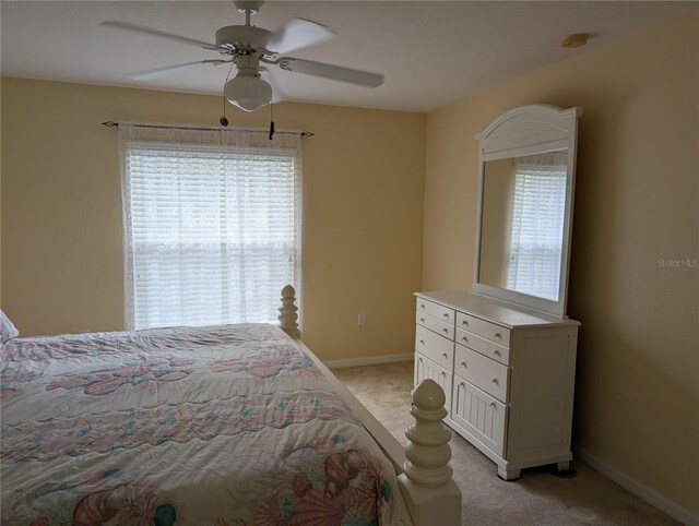 4488 Turnberry Ln, Lake Wales, FL 33859 - bedroom featuring light colored carpet, baseboards, and a ceiling fan