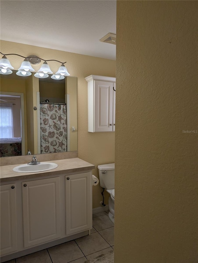 4488 Turnberry Ln, Lake Wales, FL 33859 - full bath with tile patterned flooring, vanity, toilet, and a shower with curtain