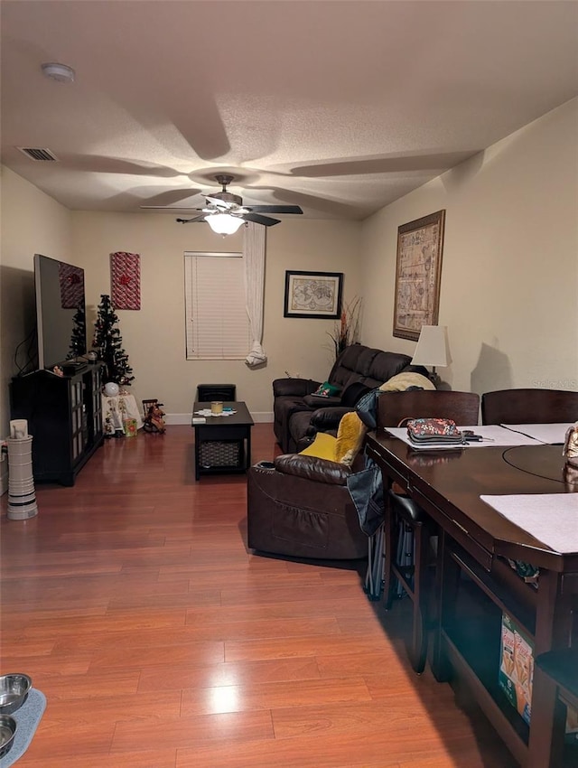 836 41st Ave N, Saint Petersburg, FL 33703 - living area with ceiling fan, wood finished floors, and baseboards