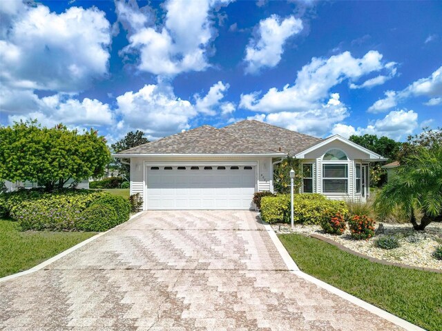 4005 Carter Creek Dr, Avon Park, FL 33825 - single story home with concrete driveway and a garage