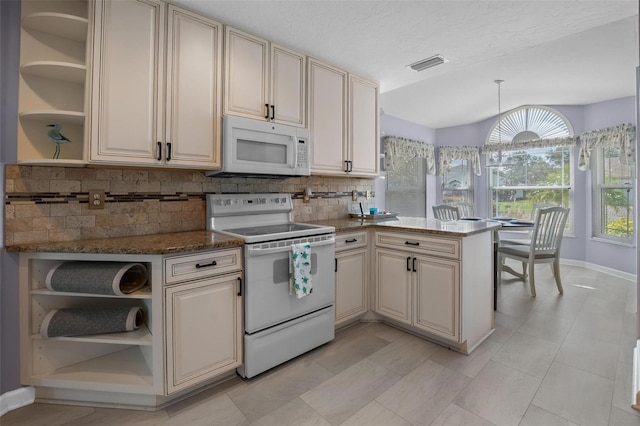 4005 Carter Creek Dr, Avon Park, FL 33825 - kitchen featuring open shelves, white appliances, cream cabinetry, decorative backsplash, and lofted ceiling