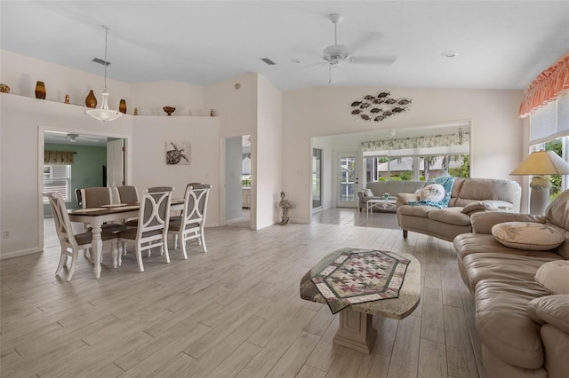 4005 Carter Creek Dr, Avon Park, FL 33825 - living room with a ceiling fan, light wood-style floors, high vaulted ceiling, and baseboards