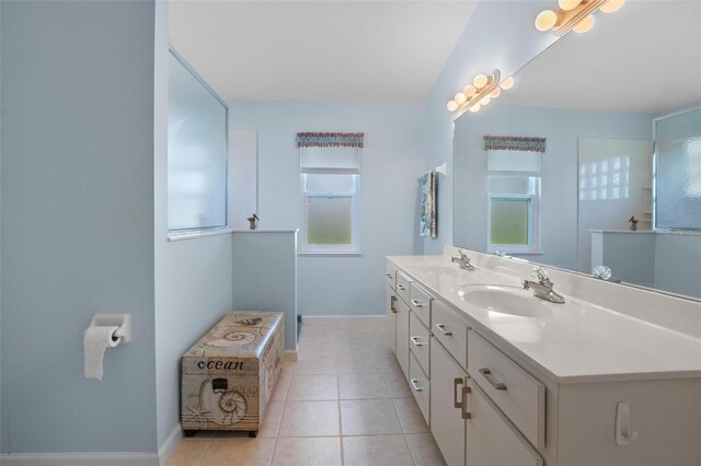 4005 Carter Creek Dr, Avon Park, FL 33825 - bathroom with baseboards, double vanity, and tile patterned flooring