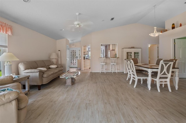 4005 Carter Creek Dr, Avon Park, FL 33825 - living room featuring lofted ceiling, ceiling fan, and light wood-type flooring