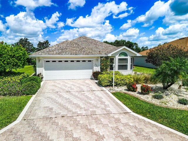 4005 Carter Creek Dr, Avon Park, FL 33825 - ranch-style home featuring driveway and an attached garage