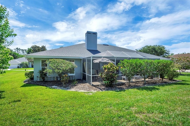 109 Lake Mariam Way, Winter Haven, FL 33884 - back of property featuring a lawn, a patio area, a chimney, a lanai, and a shingled roof