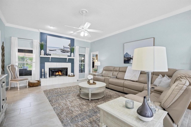 109 Lake Mariam Way, Winter Haven, FL 33884 - living area featuring ornamental molding, ceiling fan, and a fireplace