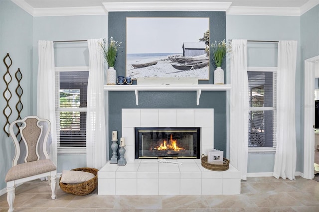 109 Lake Mariam Way, Winter Haven, FL 33884 - detailed view of crown molding, a tiled fireplace, and baseboards