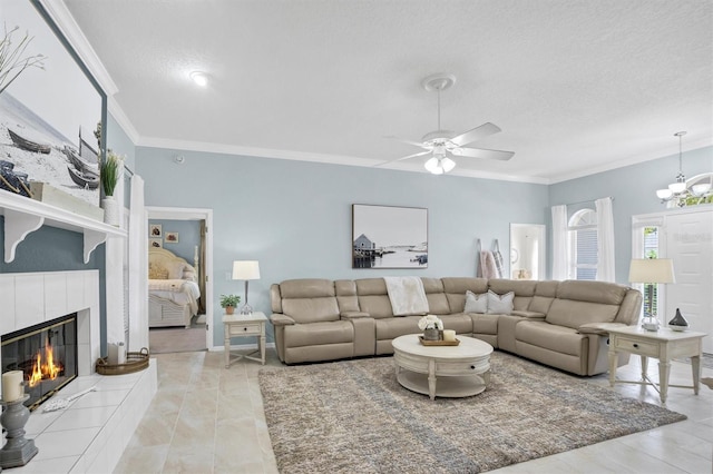109 Lake Mariam Way, Winter Haven, FL 33884 - living area with crown molding, a fireplace, a ceiling fan, a chandelier, and a textured ceiling