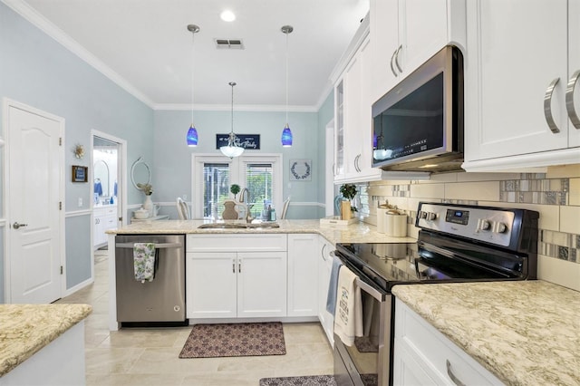 109 Lake Mariam Way, Winter Haven, FL 33884 - kitchen featuring stainless steel appliances, a sink, a peninsula, white cabinetry, and backsplash