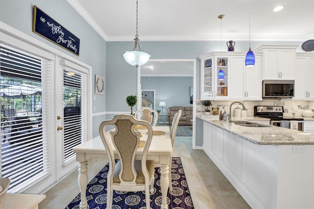 109 Lake Mariam Way, Winter Haven, FL 33884 - dining room featuring ornamental molding, light tile patterned floors, and recessed lighting