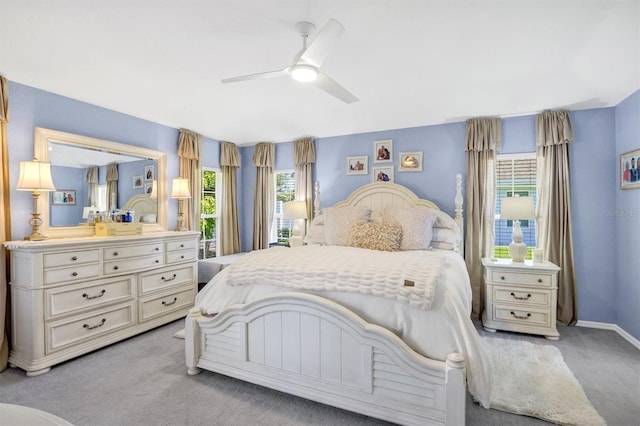 109 Lake Mariam Way, Winter Haven, FL 33884 - bedroom with light colored carpet, ceiling fan, and baseboards