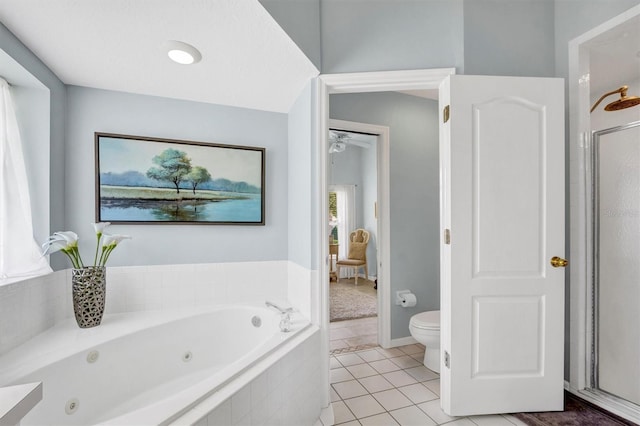 109 Lake Mariam Way, Winter Haven, FL 33884 - full bath with a tub with jets, tile patterned flooring, a shower stall, toilet, and a ceiling fan