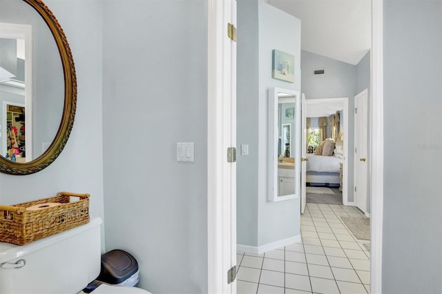 109 Lake Mariam Way, Winter Haven, FL 33884 - hall featuring vaulted ceiling, light tile patterned floors, and baseboards