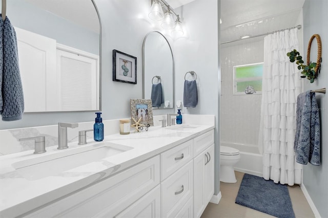 109 Lake Mariam Way, Winter Haven, FL 33884 - bathroom featuring double vanity, shower / tub combo, baseboards, and toilet