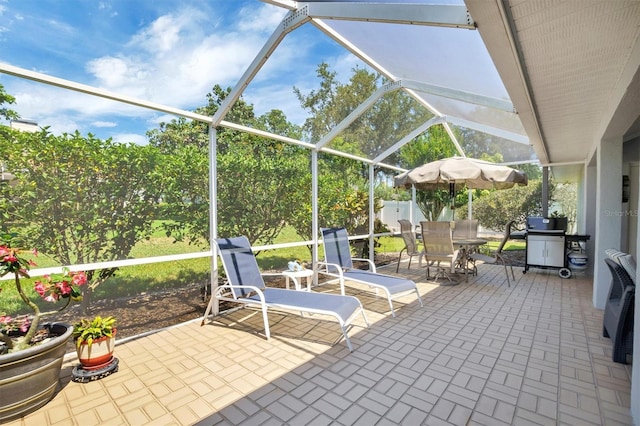109 Lake Mariam Way, Winter Haven, FL 33884 - view of patio / terrace with glass enclosure and outdoor dining space