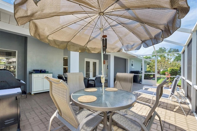 109 Lake Mariam Way, Winter Haven, FL 33884 - view of patio featuring french doors, outdoor dining area, and a lanai