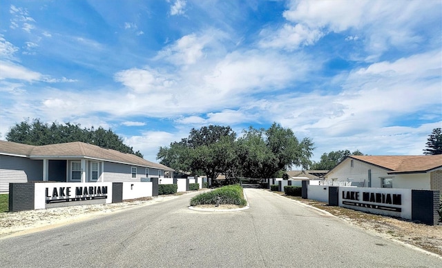 109 Lake Mariam Way, Winter Haven, FL 33884 - view of asphalt street featuring a residential view and a gate